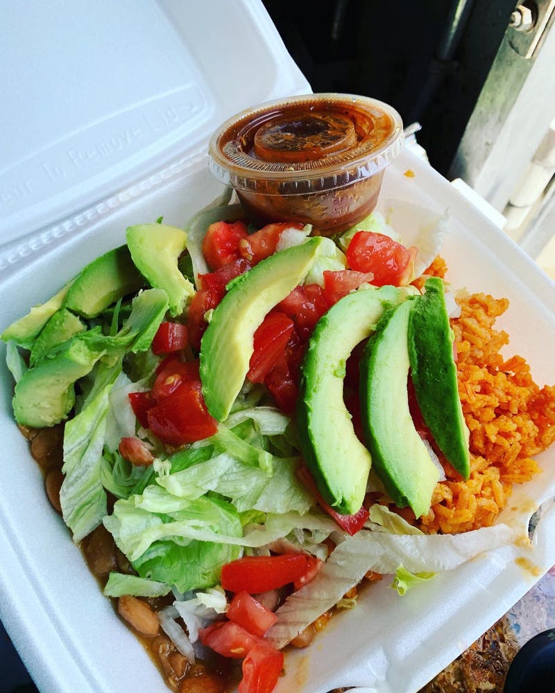 a plate of food with a sandwich and a salad